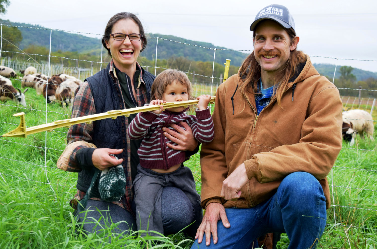 Farm family with sheep