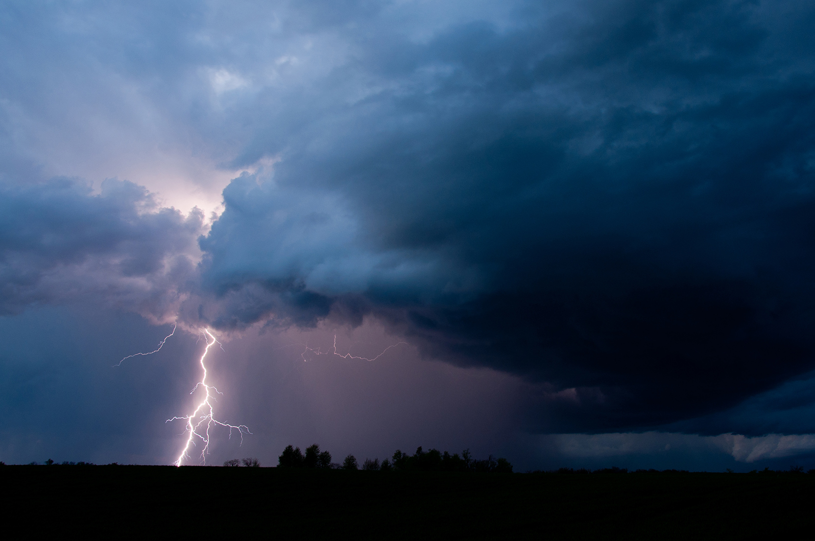 Dark storm clouds and lightning